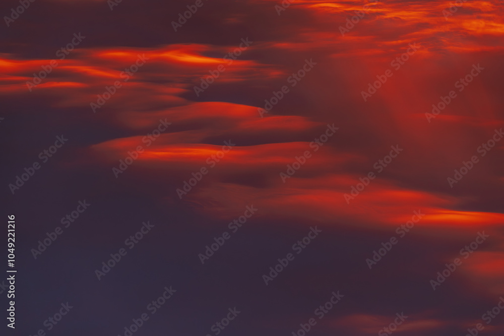 A captivating sky at sunset with dark red and orange clouds, creating a striking and moody atmosphere. The layered clouds add depth and intensity to the scene. A captivating sky at sunset with dark red and orange clouds, creating a striking and moody atmosphere. The layered clouds add depth and intensity to the scene.