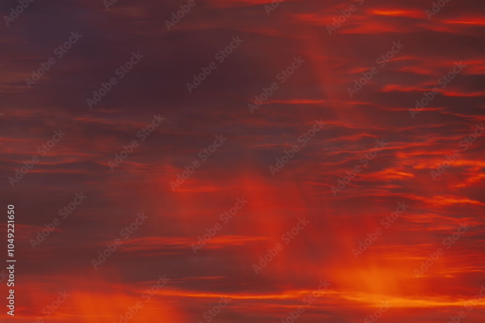A vibrant, fiery sky with rich red and orange clouds, capturing the dramatic beauty of a sunset. The gradient of colors creates a warm, atmospheric scene. A vibrant, fiery sky with rich red and orange clouds, capturing the dramatic beauty of a sunset. The gradient of colors creates a warm, atmospheric scene.