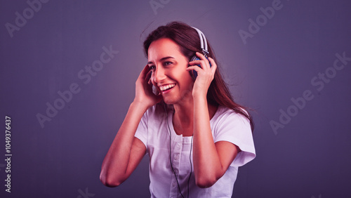 Young woman enjoying music with headphones and smiling