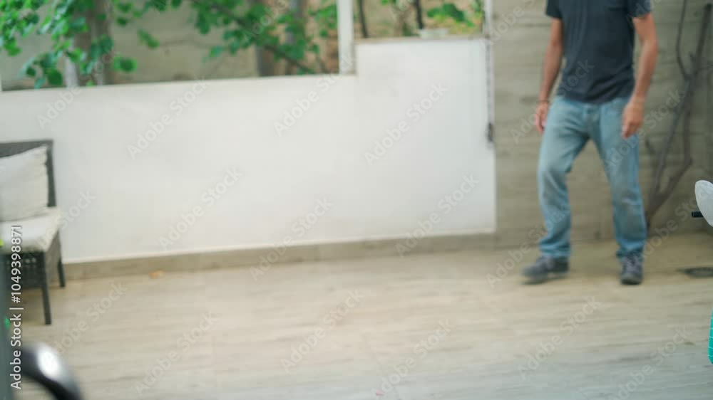 Dog playing fetch in a sunny backyard with owner, showcasing energy and joy during afternoon fun Dog playing fetch in a sunny backyard with owner, showcasing energy and joy during afternoon fun