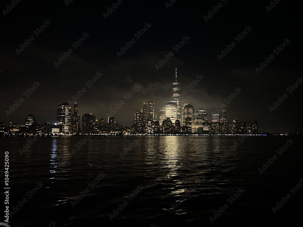 New York City Skyline at Night City Lights Reflection on Water Stock ...