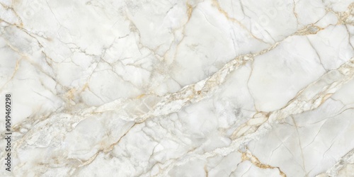 A smooth, pristine marble surface with veins of gold and silver, creating a captivating natural design.