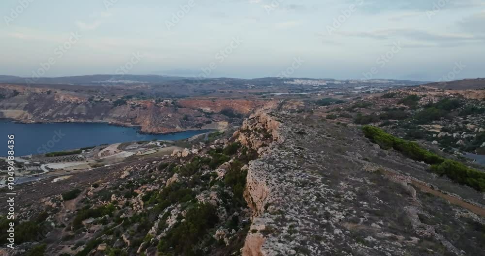 Aerial View of the Stunning Natural Landscape along the Seashore of Malta Showcasing Beautiful Rocky Cliffs and Crashing Mediterranean Waves. High quality 4k footage Aerial View of the Stunning Natural Landscape along the Seashore of Malta Showcasing Beautiful Rocky Cliffs and Crashing Mediterranean Waves. High quality 4k footage