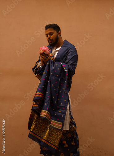 Portrait of man holding flower