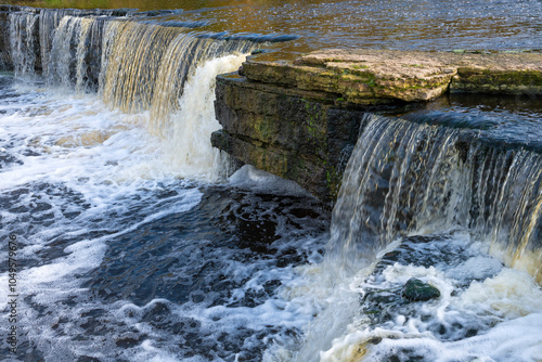 Fragment of Tosna waterfall on a October day. Leningrad region, Russia