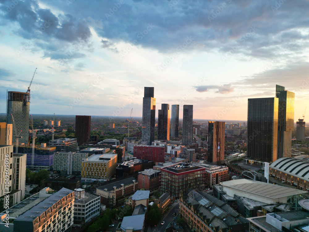 Obraz premium Aerial View of Greater Manchester City Centre and Tall Buildings During Golden Hour of Sunset, England UK. High Angle View Was Captured with Drone's Camera on the day of May 5th, 2024