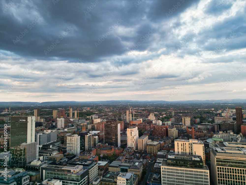 Obraz premium Aerial View of Greater Manchester City Centre and Tall Buildings During Golden Hour of Sunset, England UK. High Angle View Was Captured with Drone's Camera on the day of May 5th, 2024