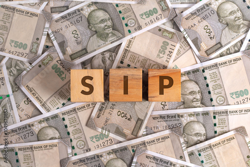 SIP Word on Wooden Cubes with Indian Currency Background | Financial Growth Concept