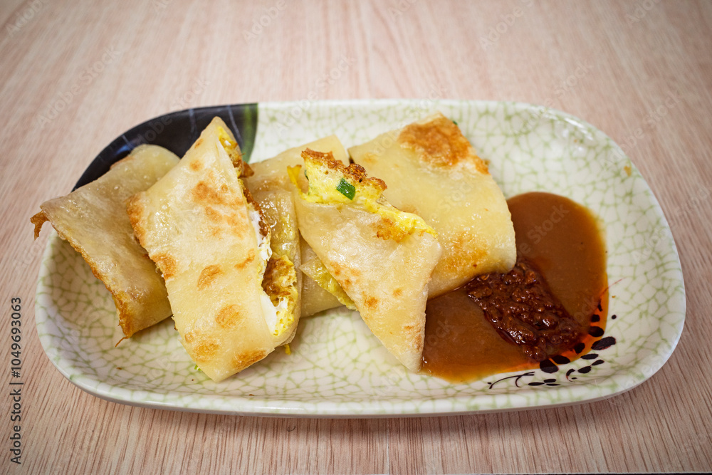 A popular breakfast dish in Taiwan known as Taiwanese egg pancakes. A popular breakfast dish in Taiwan known as Taiwanese egg pancakes.