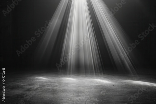 Light beams shining through a dark space, creating a dramatic spotlight effect.