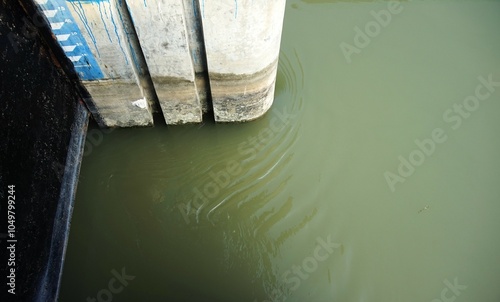 murky, flowing irrigation river water photo