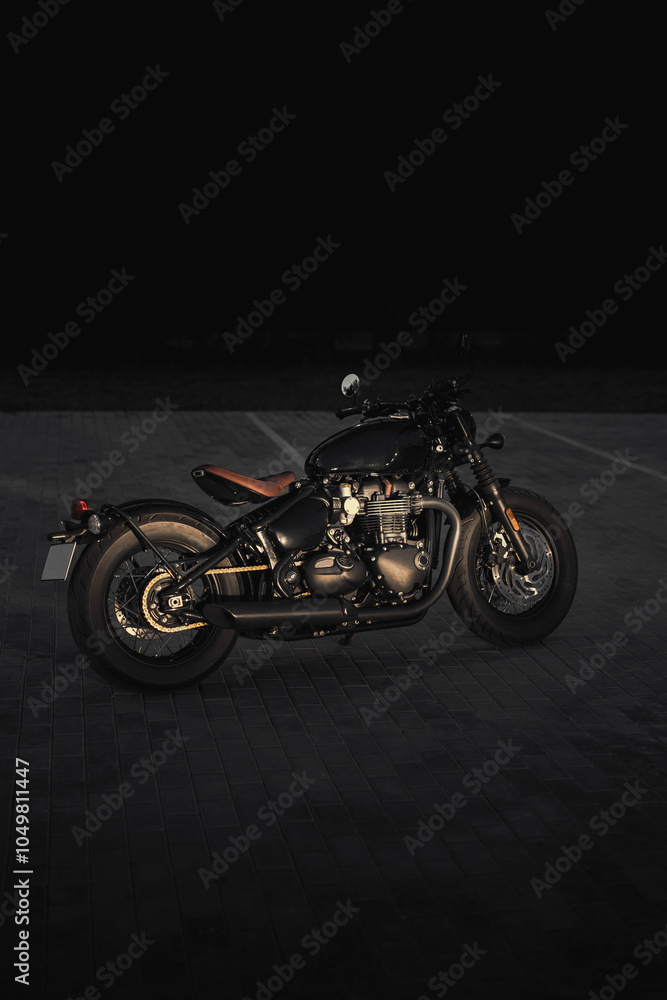 Photo of a motorcycle on the road at night Photo of a motorcycle on the road at night