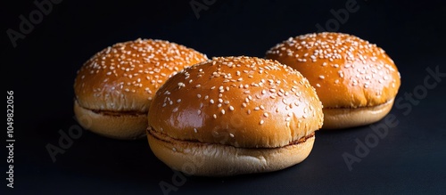 Burger buns set against a b...