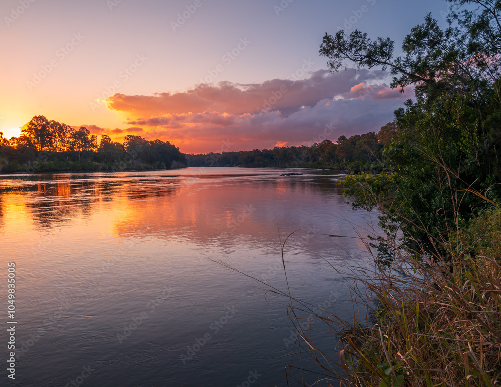 Fototapeta premium Sunset Over the River with Reflections