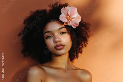 A woman wearing flowers as part of her hairstyle photo