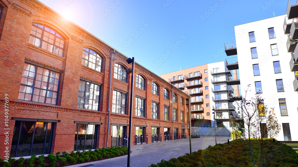 Fototapeta premium Modern multifamily building in a european city. Walls made of concrete. Luxury house complex.