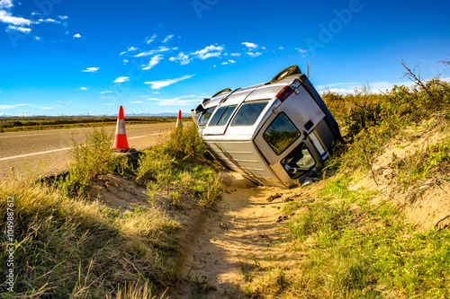 An old crashed van on the side of a road photo