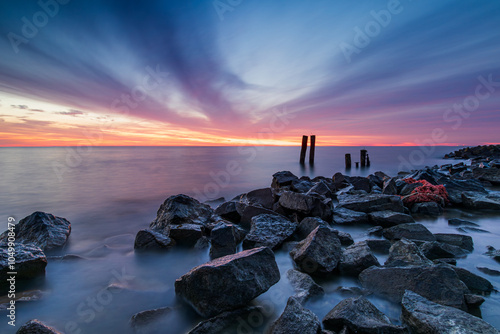 Wallpaper Mural Colorful cloud-filled sky over the IJsselmeer near Den Oever, Netherlands. During the blue hour on this beautiful morning, a spectacular display of colors takes place above the IJsselmeer. Torontodigital.ca