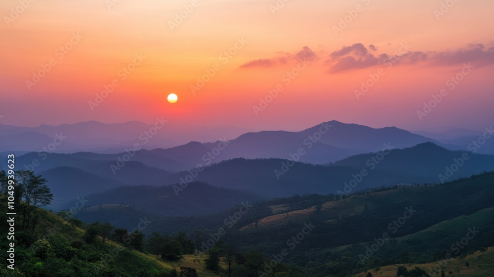 Fototapeta premium A beautiful sunset view from Phu Ruea, with the sky painted in shades of orange and pink
