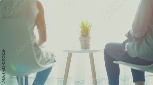 A healthcare worker conducting a mental health counseling session with a patient in a serene therapy office against a soft, calming background, macro shot photo