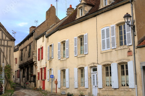 typical streets with old houses in Noyers sur Serein, France, Europe