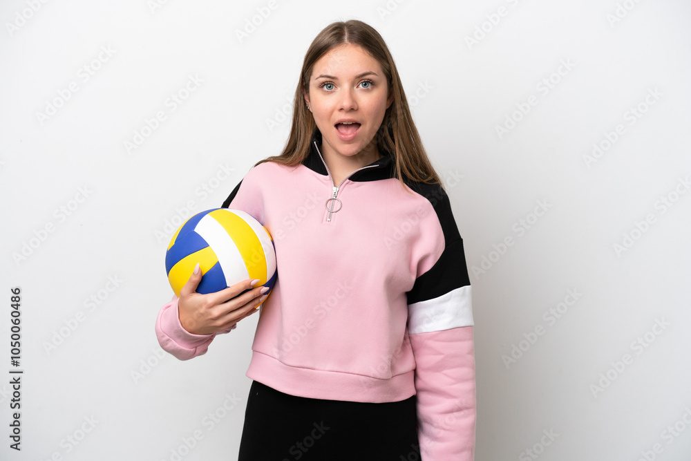 Young Lithuanian woman playing volleyball isolated on white background with surprise facial expression Young Lithuanian woman playing volleyball isolated on white background with surprise facial expression