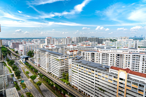 A landscape view of singapore HDB housing with bright sky and clouds
