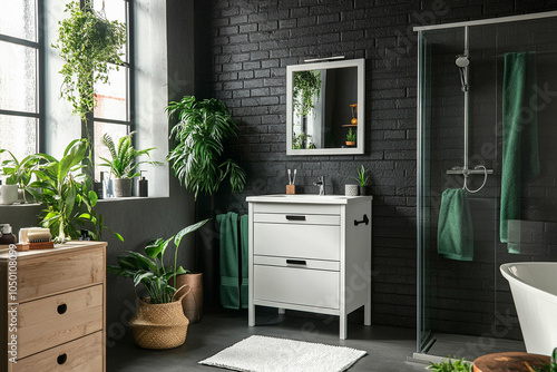 Creative composition of bathroom interior with white bath, black wall, plants and personal accessories. Home decor. photo