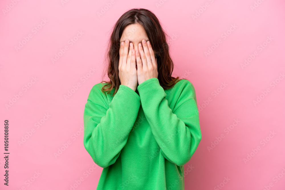 Young caucasian woman isolated on pink background covering eyes by hands Young caucasian woman isolated on pink background covering eyes by hands