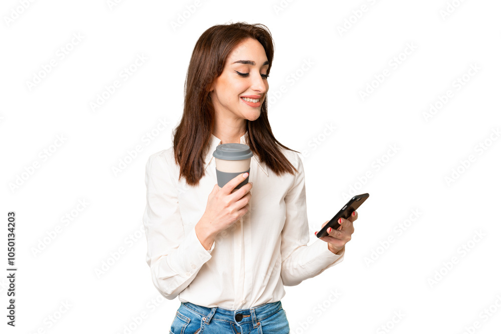Young caucasian woman over isolated chroma key background holding coffee to take away and a mobile Young caucasian woman over isolated chroma key background holding coffee to take away and a mobile