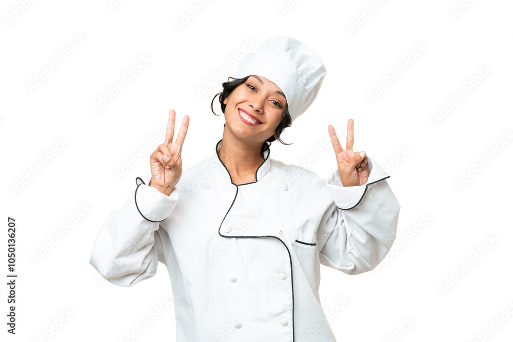 Young chef Argentinian woman over isolated background showing victory sign with both hands Young chef Argentinian woman over isolated background showing victory sign with both hands