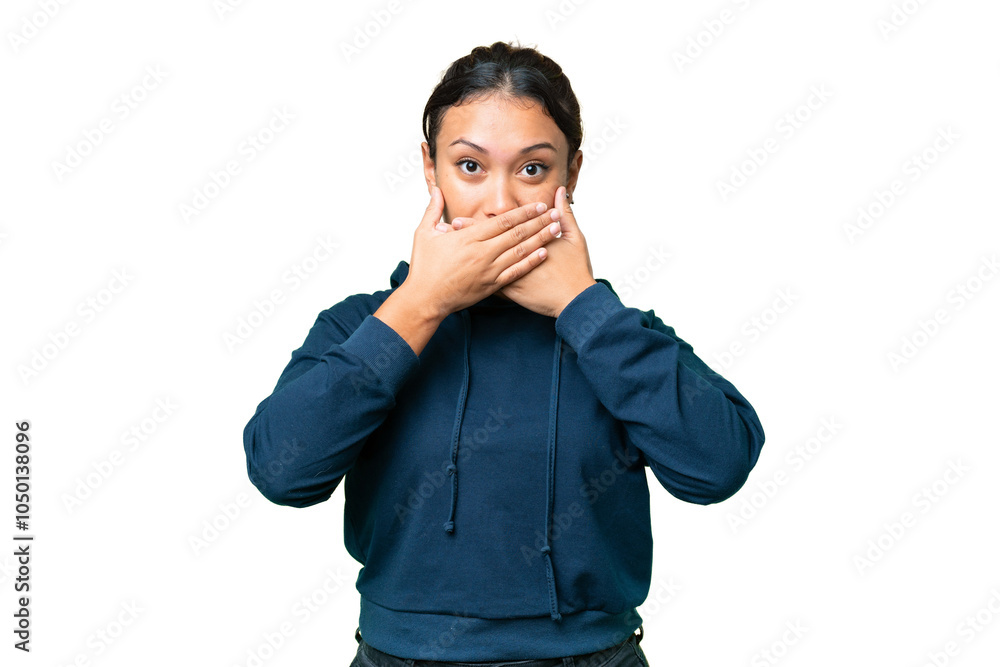 Young Uruguayan woman over isolated chroma key background covering mouth with hands Young Uruguayan woman over isolated chroma key background covering mouth with hands