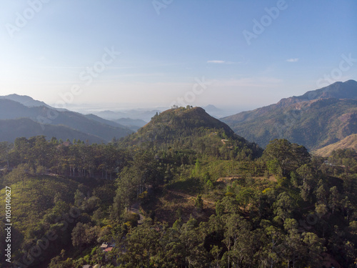 Aerial view of serene mountainous landscape under a clear sky.