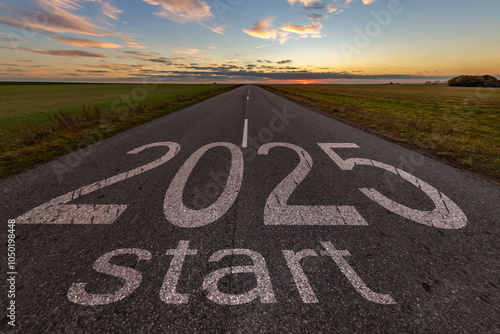 numbers 2025 and start on asphalt road highway with cracks with sunrise or sunset sky background. concept of destination in future, freedom, work start, run, planning, challenge, target, new year