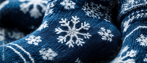 Closeup of socks with snowflake patterns, cozy winter setting, National Sock Day celebration photo