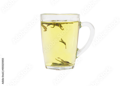 Tea brewing process in transparent glass cup. Dragon Well green tea (Longjing tea). Isolated on a white background. photo