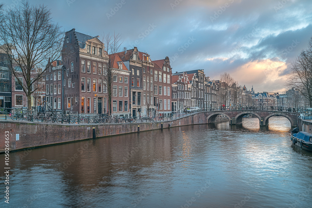 Panoramic view of the historic city in style of center of Amsterdam. Traditional houses and bridges of Amsterdam.