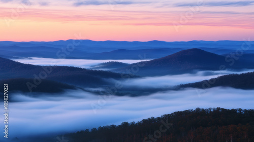 Wallpaper Mural An aerial view of a majestic mountain range enveloped by low, misty clouds, illuminated by the warm hues of sunset. The golden light casts a soft glow over the peaks,  Torontodigital.ca
