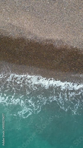 Amazing drone footage shows a clear ocean and the coastline of a Greek island from a straight-up, bird’s-eye view