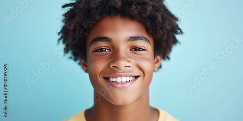 Black teenager boy on a studio background