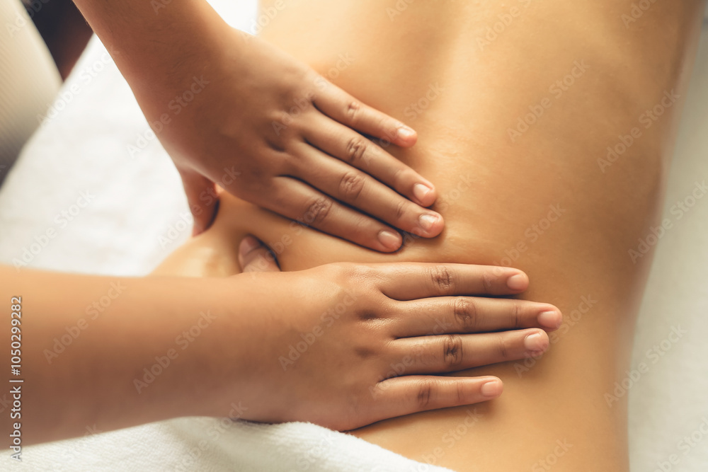 Closeup woman customer enjoying relaxing anti-stress spa massage and pampering with beauty skin recreation leisure in day light ambient salon spa at luxury resort or hotel. Quiescent Closeup woman customer enjoying relaxing anti-stress spa massage and pampering with beauty skin recreation leisure in day light ambient salon spa at luxury resort or hotel. Quiescent
