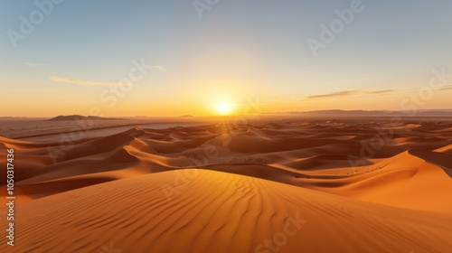 A dramatic view of the vast sand dunes and sweeping desert landscape of the Sahara with the sun setting over the horizon, desert setting with warm, golden hues