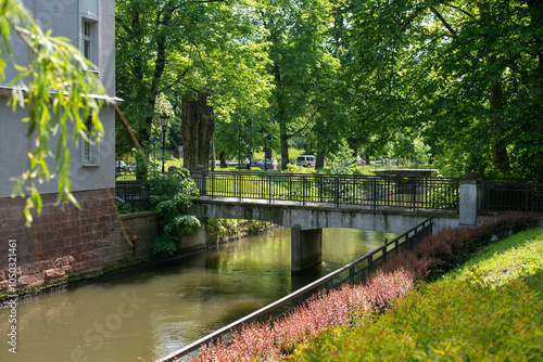 Water channels of the Nysa river in Klodzko, Poland, flowing around the historic town, with scenic views of medieval bridges and charming architecture.