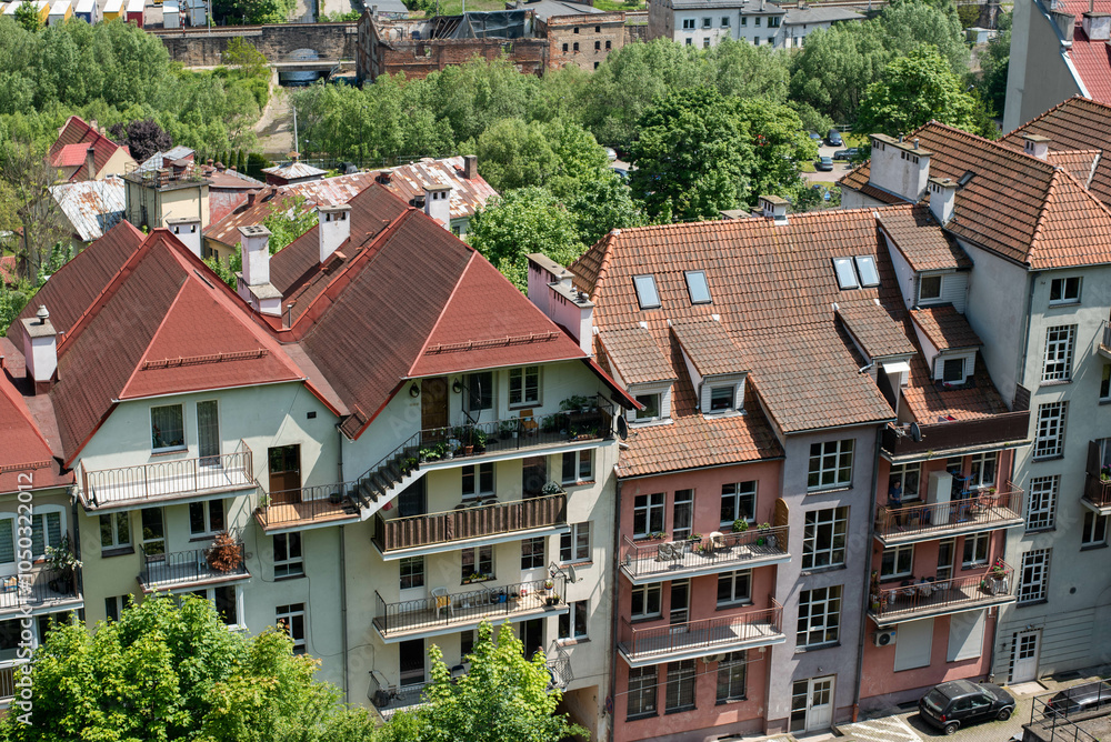 A panoramic view of the city of Klodzko from the fortress, showcasing its charming architecture, winding streets, and the scenic Nysa river below. A panoramic view of the city of Klodzko from the fortress, showcasing its charming architecture, winding streets, and the scenic Nysa river below.