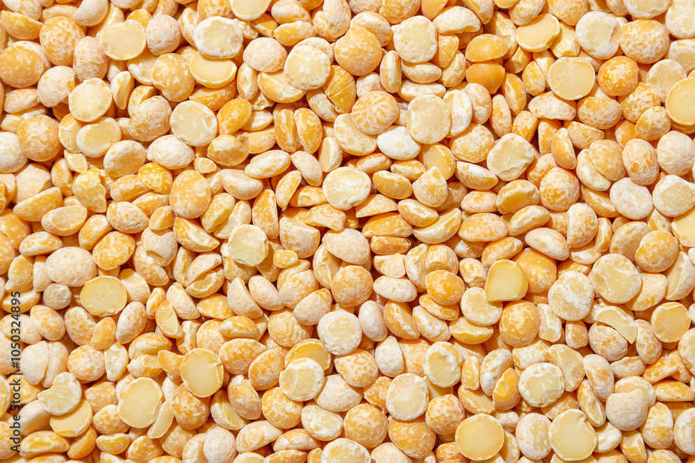 Uncooked Polished Split Peas Background. A Culinary Canvas of Dry Yellow Peas, Creating a Lively and Textured Background for Gourmet Cooking. Scattered Raw Polished Peas. Healthy Eating Ingredients Uncooked Polished Split Peas Background. A Culinary Canvas of Dry Yellow Peas, Creating a Lively and Textured Background for Gourmet Cooking. Scattered Raw Polished Peas. Healthy Eating Ingredients