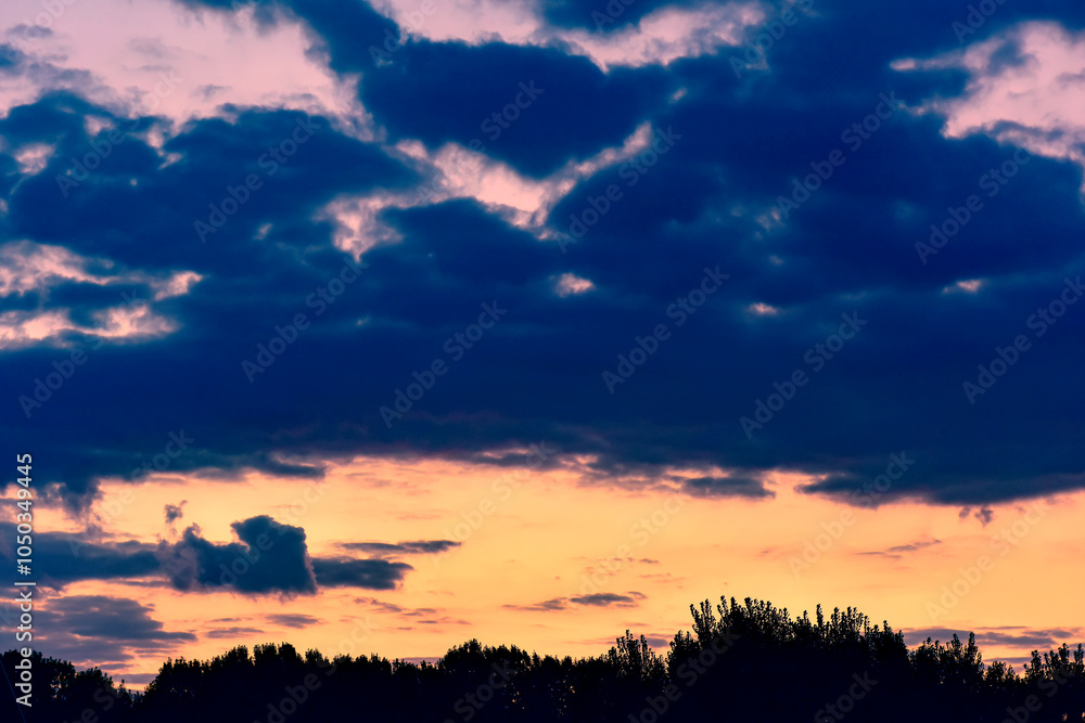 Obraz premium The sunset background creates a beautiful scenery with the suspension bridge and river