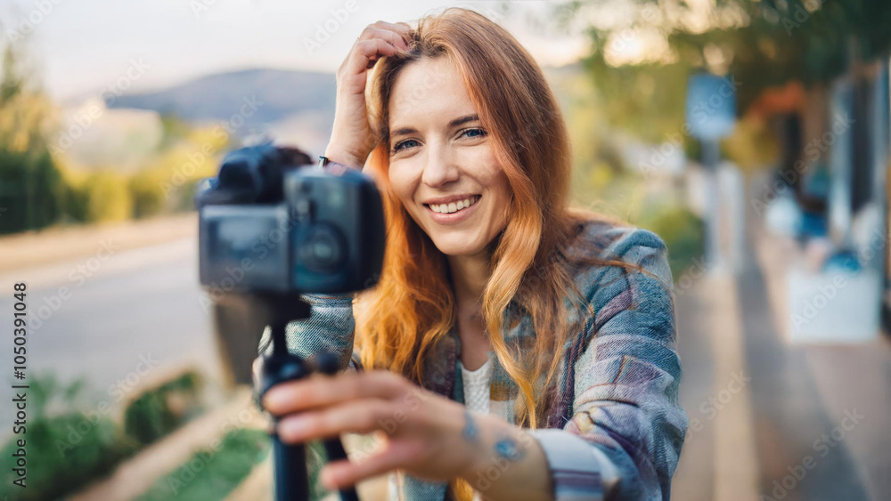 woman making video blog with smartphone gimbal outdoor . Happy caucasian influencer having fun with new technology trends for social media - People, generation z, tech and youth lifestyle concept woman making video blog with smartphone gimbal outdoor . Happy caucasian influencer having fun with new technology trends for social media - People, generation z, tech and youth lifestyle concept