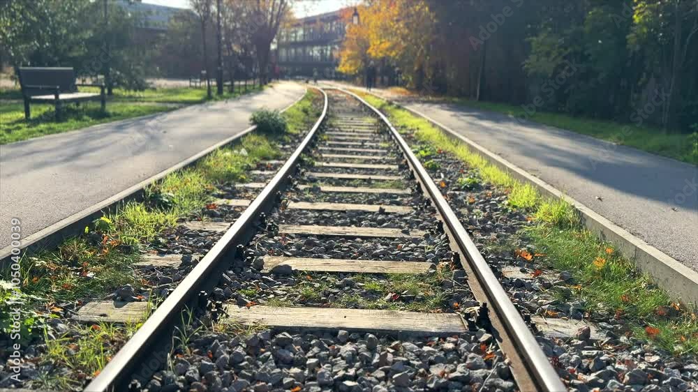 Railway tracks in autumn. Empty railway tracks on a sunny autumn day. Railway tracks in autumn. Empty railway tracks on a sunny autumn day.