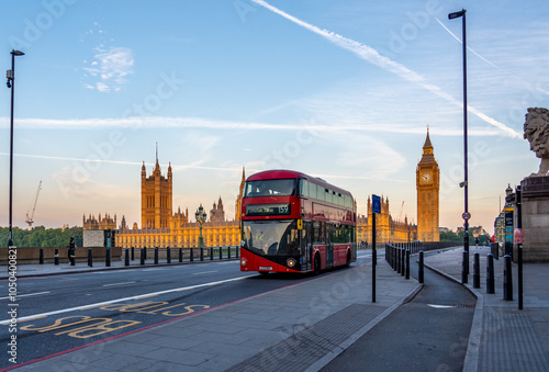 London Double decker Bus with Big Beng in the Background during Colorful Sunrise