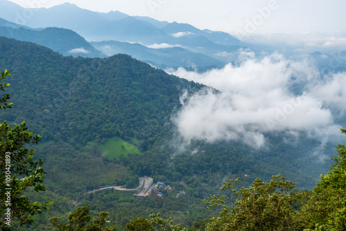 wayanad kerala western ghats landscape with clouds and fog with roads down
